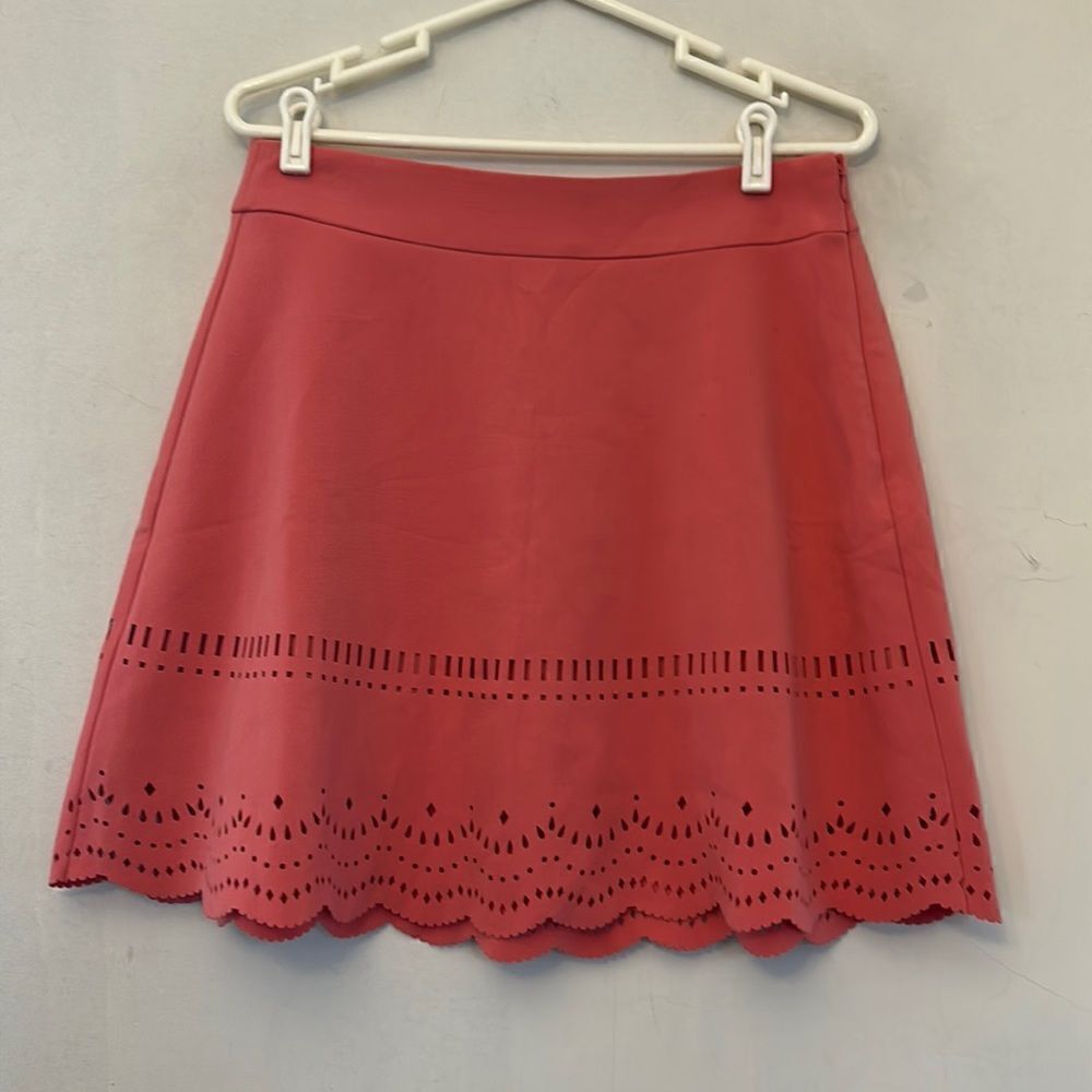 Loft coral skirt with cutout design along the bottom Size 8 NWT